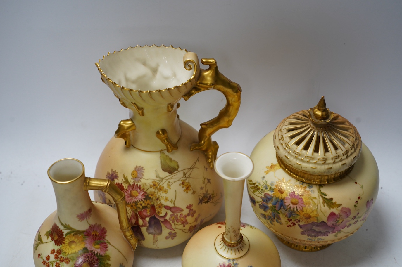 Four Worcester blush ivory floral vases and ewers, 1748, 1132, 1507 & 1286, largest 22cm high. Condition - good